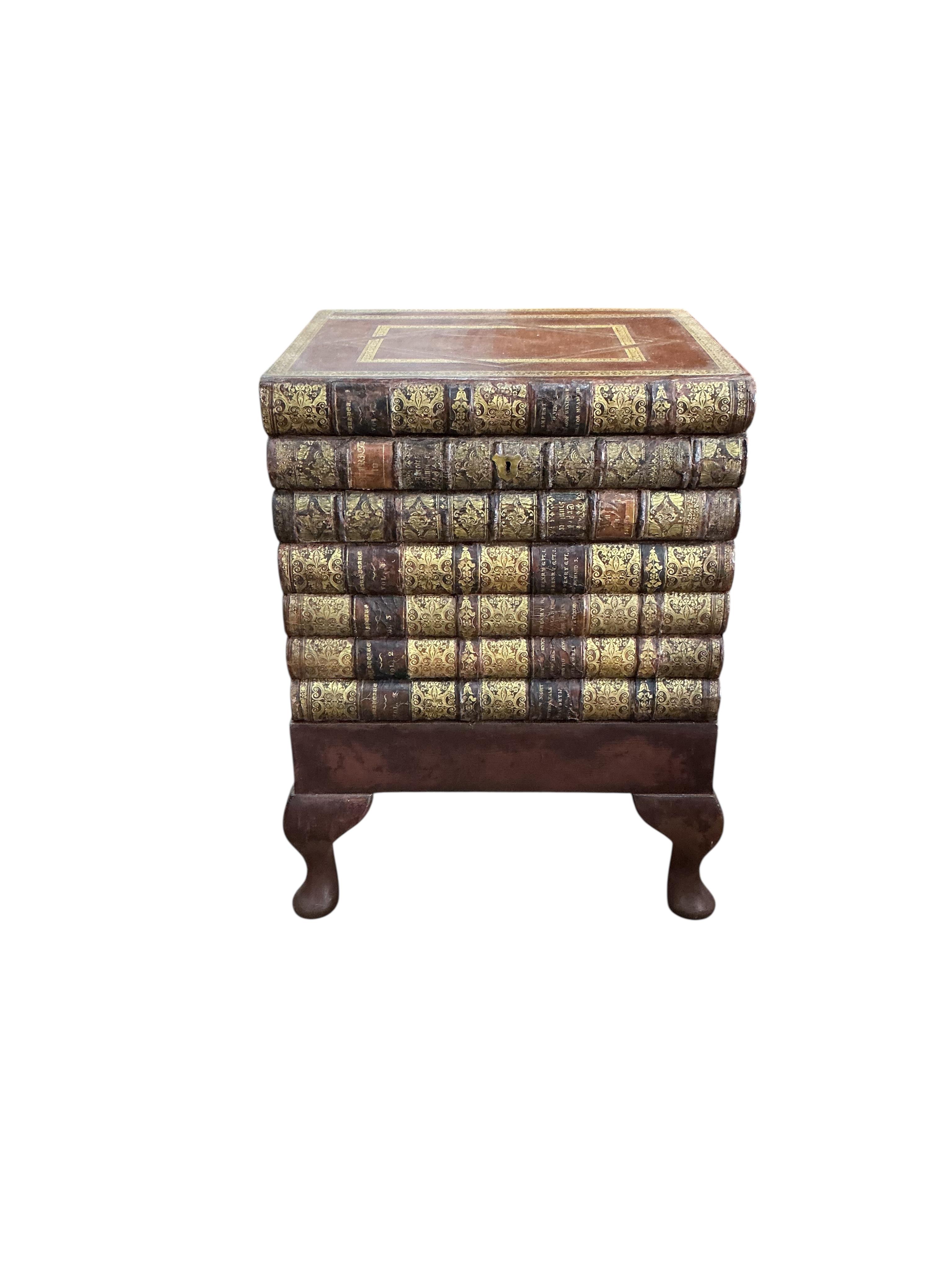 A reproduction cellarette modelled as a stack of antiquarian books, width 42cm, depth 37cm, height 58cm